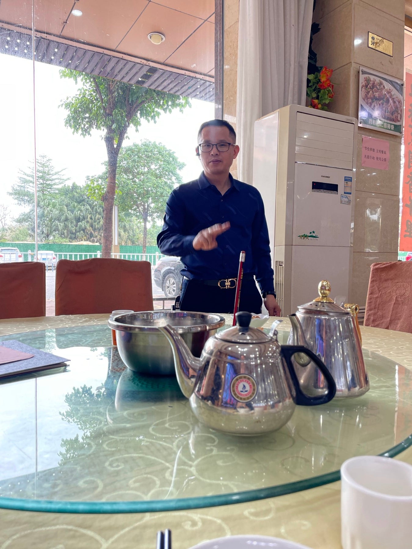 Tony in China presenting kettle samples during manufacturing work